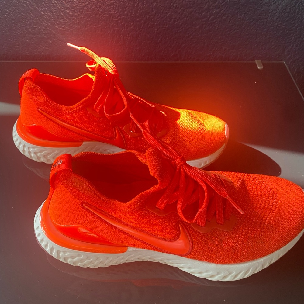 Nike running shoes. They are a red/ orange blend, only worn a handful of times.